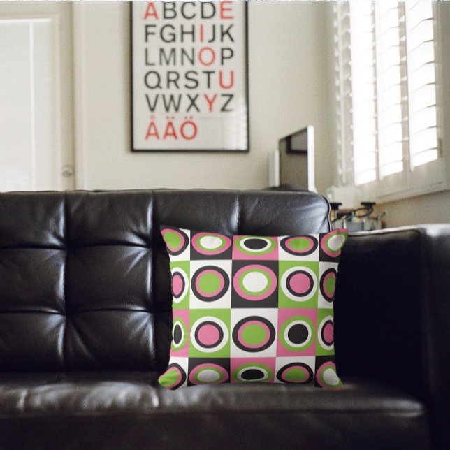 Retro-Kreise Muster rosa grün Schwarz-weiß Kissen (A throw pillow with a retro pattern of green, black, pink and white circles)