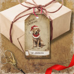 Retro Vintag Hund mit Red Christmas Hat Geschenkanhänger<br><div class="desc">Schöne Retro-Vintage Abbildung eines Hundes mit einem roten Weihnachtshut auf einem Retro-Grunge-Hintergrund und Rahmen für einen altertümlichen oder Vintagen Look. Das Design verfügt über ein Vintages Scrollband für Ihre Personalisierung sowohl vorne als auch hinten in diesem eleganten und zeitlosen Holiday Gift Tag.</div>