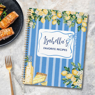Rezeptbuch mit gelben Zitronenfrüchten und blauen Notizbuch