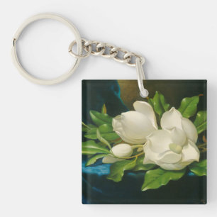 Riesige Magnolien auf einem blauen Samt-Stoff, Schlüsselanhänger