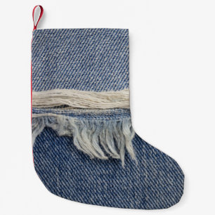 Rippte Jeans Textur, stilvoller Hintergrund. Kleiner Weihnachtsstrumpf