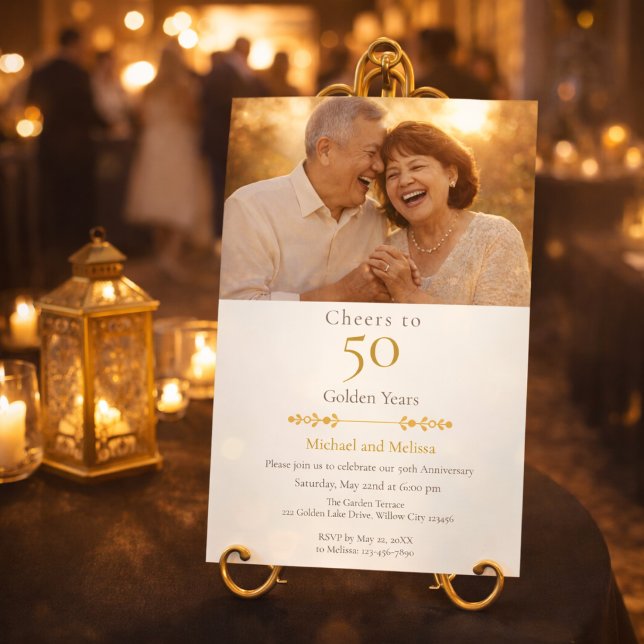 Romantic Cheers to 50 Years Gold Einladung (Elegant gold anniversary invite displayed at a romantic candlelit venue entrance)