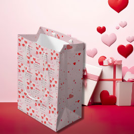Romantischer Valentinstag zwischen Rosa und Rotem Mittlere Geschenktüte