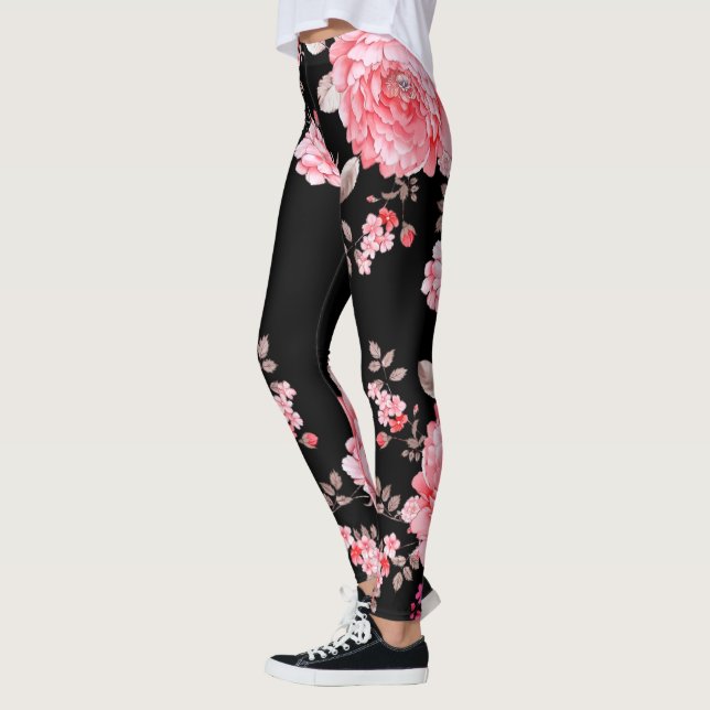 Rosa Blume mit schwarzem Hintergrund. Leggings (Links)