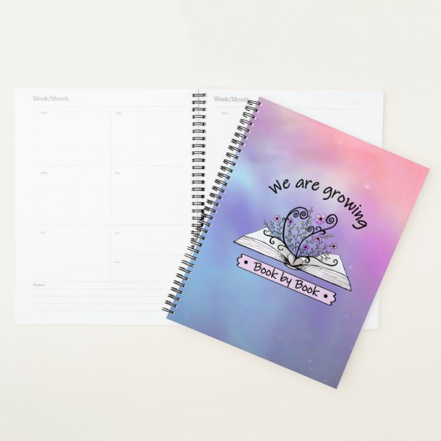 Rosa Blumen, die aus Buch wachsen Planer (Anzeige)