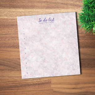 Rosa Bokeh-Design mit buchstabierter To-Do-Liste Notizblock