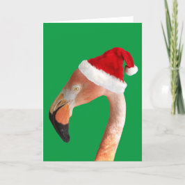 Rosa Flamingo in einer roten Weihnachtsmannmütze Feiertagskarte