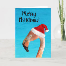 Rosa Flamingo in einer roten Weihnachtsmannmütze W Feiertagskarte