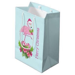 Rosa Flamingo in Weihnachtsmannmütze mit Candy Can Mittlere Geschenktüte