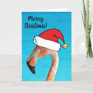 Rosa Flamingo mit rotem Cartoon-Santa-Hut Weihnach Feiertagskarte