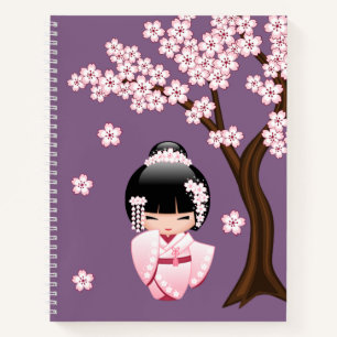 Rosa Kimono Kawaii Kokeshi-Puppe auf Lila Notizbuch