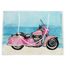 Rosa Motorrad am Strand