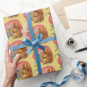 Rosa Ostereier und sonniges auf gelbem Wrapping Pa Geschenkpapier