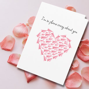 Rosa Papierflugzeug-Herz Romantischer Valentinstag Karte