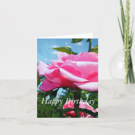 Rosa Rosa Blume und grüne Blätter in Blau Karte