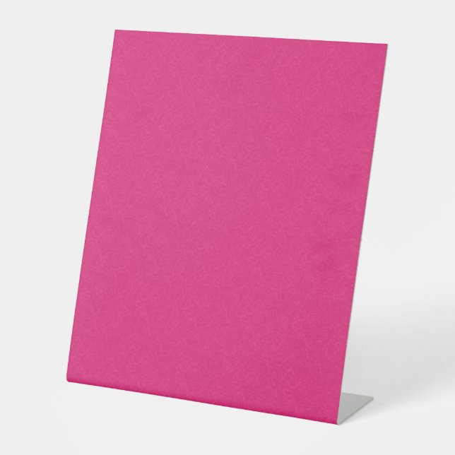 Rosa texturierte Oberfläche mit subtilem, wirbelnd Sockelschild (Vorderseite)