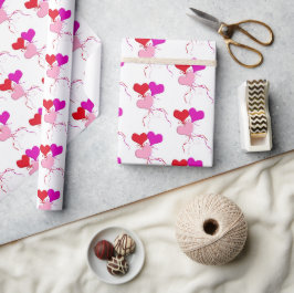 Rosa und rote Herzblasen auf Weiß Geschenkpapier