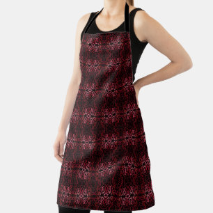 Rosa und rote Punkte und Schlängelchen-Muster auf Schürze