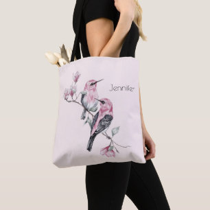 Rosa und schwarze Vögel auf einem Baumzweig