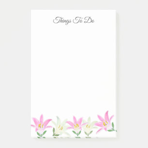 Rosa und weiße Amaryllis auf weißen Dingen, die zu Post-it Klebezettel