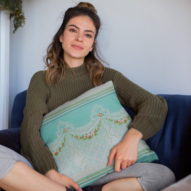 Rose Garlands Lacy Swags Bow Knots Homedecor Kissen (mockup of a woman holding a Roses Garlands Lacy Swags Bow Knots Homedecor Throw Pillow)