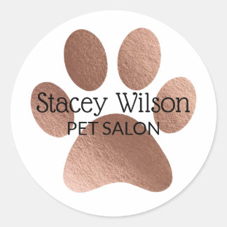 Rose-Gold-Paw-Printlogos auf dem weißen Produkteti Runder Aufkleber
