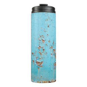 Rostiges blaues Metall: Texturierte Wand. Thermosbecher