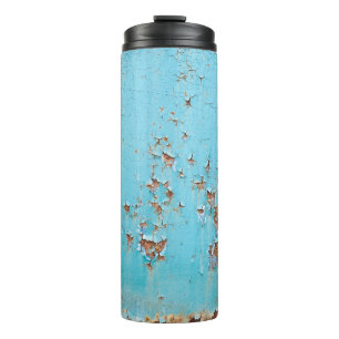 Rostiges blaues Metall: Texturierte Wand. Thermosbecher