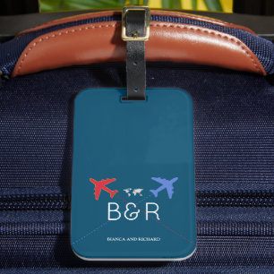 rot-blaue Flugzeuge mit dem Namen des Paares Gepäckanhänger