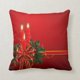 Rot leuchtet Band und Stechpalme durch Kissen