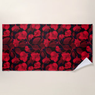 Rote Blume auf schwarz Strandtuch