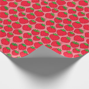 Rote Erdbeeren auf Rosa Geschenkpapier
