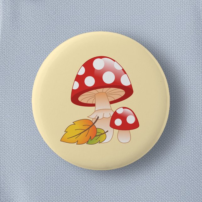 Rote Kappe Toadstool Pilze und Blätter auf Gelb Button (Von Creator hochgeladen)