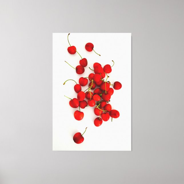Rote Kirschen auf weißer Seite Leinwanddruck (Vorderseite)
