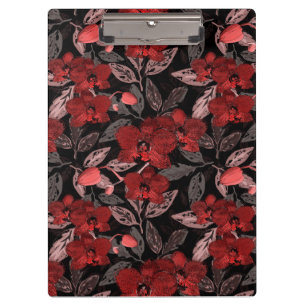 Rote Orchideen auf schwarz. Klemmbrett