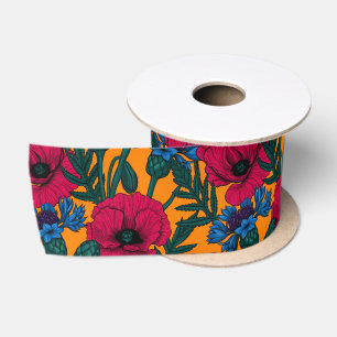 Rote Pfeffer und blaue Kornblumen auf Orange Satinband