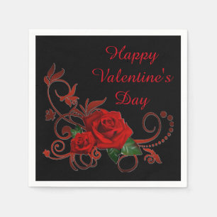 Rote Rosen des Valentines Tagesrot und schwarze Serviette