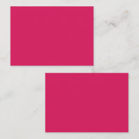 Rote und rosa Blume mit üppig grünem l