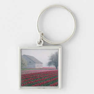 Rote und rosa Tulpen begrüßen den Tag an einem neb Schlüsselanhänger