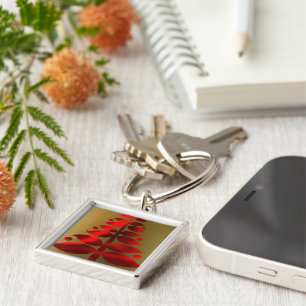 Rote Weihnachtsbaumen auf Gold Schlüsselanhänger