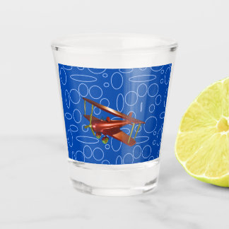Rotes Bi-Flugzeug auf blauem Kreislauf und Loops-G Schnapsglas
