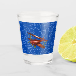 Rotes Bi-Flugzeug auf blauem Kreislauf und Loops-G Schnapsglas