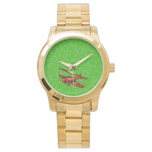 Rotes Bi-Flugzeug auf grünen Kreisläufen und Schle Armbanduhr