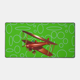 Rotes Bi-Flugzeug auf grünen Kreisläufen und Schle Schreibtischunterlage