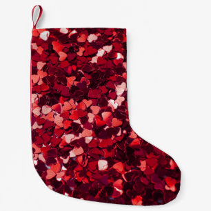 Rotes Glitzer Herz: Minimalistische Textur. Kleiner Weihnachtsstrumpf