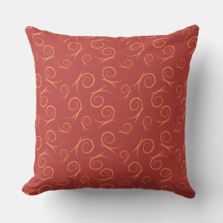 Rotes Kissen mit abstrakten Designs
