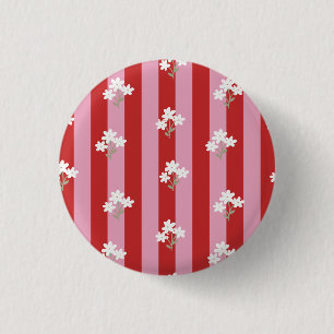 rotes und rosa Streifendesign mit weißen Blumen Button