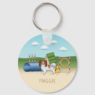 Rotes und weißes Papillon mit Agility Schlüsselanhänger