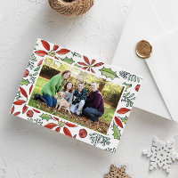 Rotes Wasser gestrichen Poinsettia und Holly-Foto