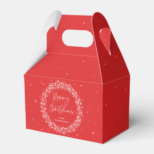 Rotes Weihnachtsgesteck mit funkelnden Lichtern Geschenkschachtel